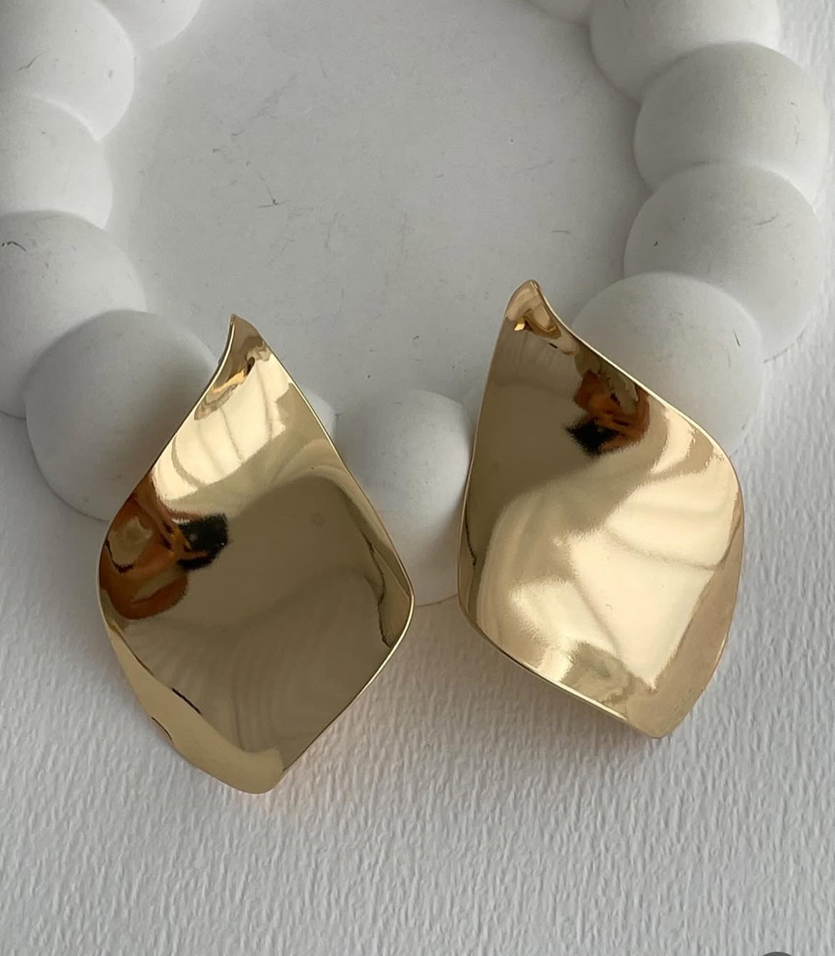 Large curved earrings