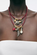 Red cord layered necklace with charms