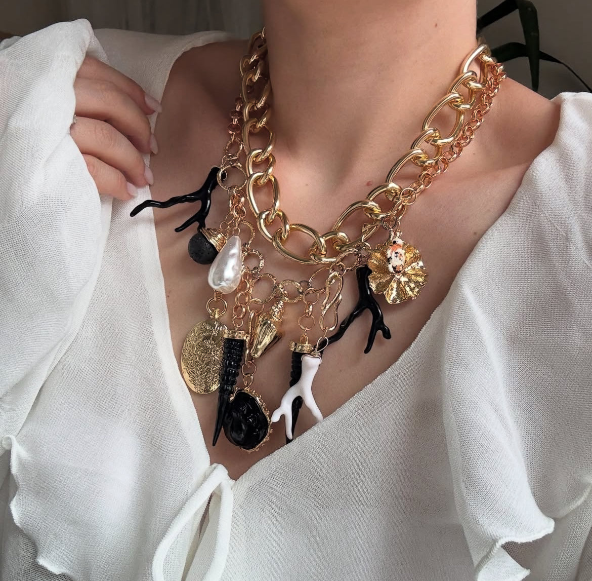 Double large chains with black charms