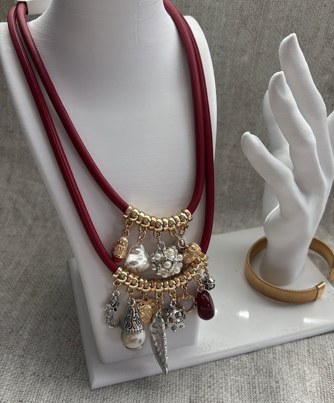 Red cord layered necklace with charms