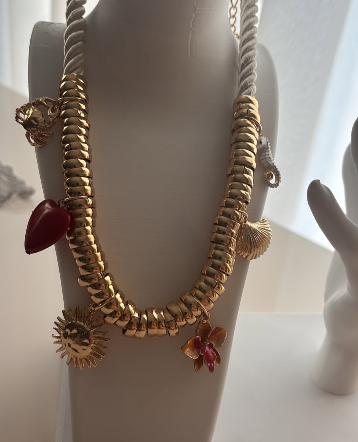Cord necklace with golden charms